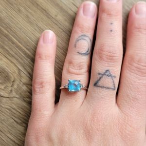 Blue topaz and diamond ring